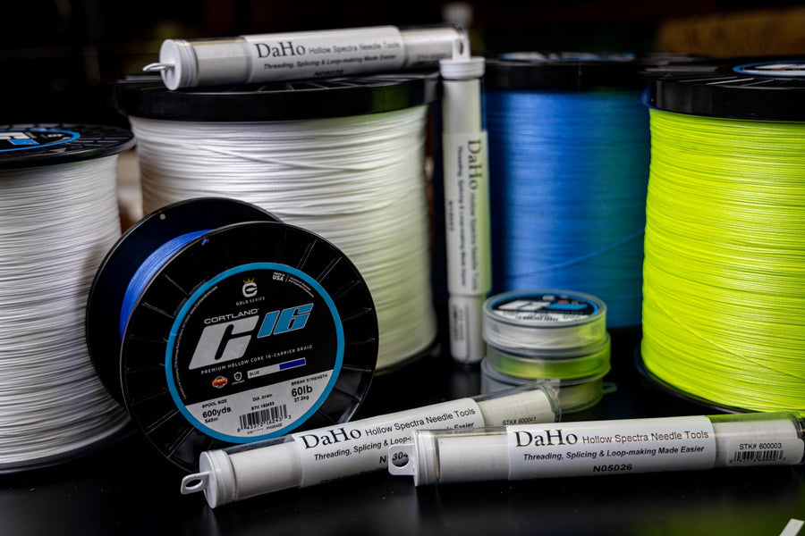 White, Blue, and Neon colored spools of C16 and Daho Threading Needles