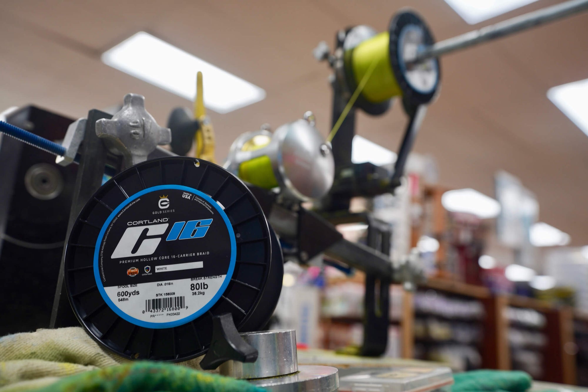 A large spool of C16 is being prepared on a fly reel