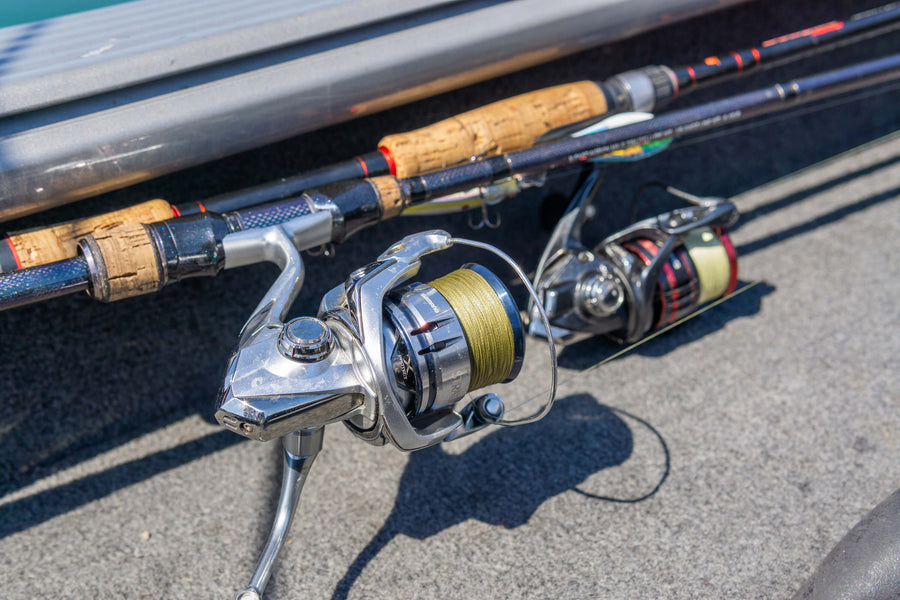 Closeup shot of two fishing poles. The pole in view is lined with Cortland Master Braid Bronze. 